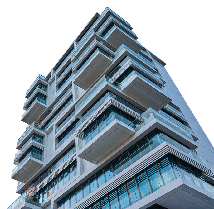 Modern building with glass balconies, night view.